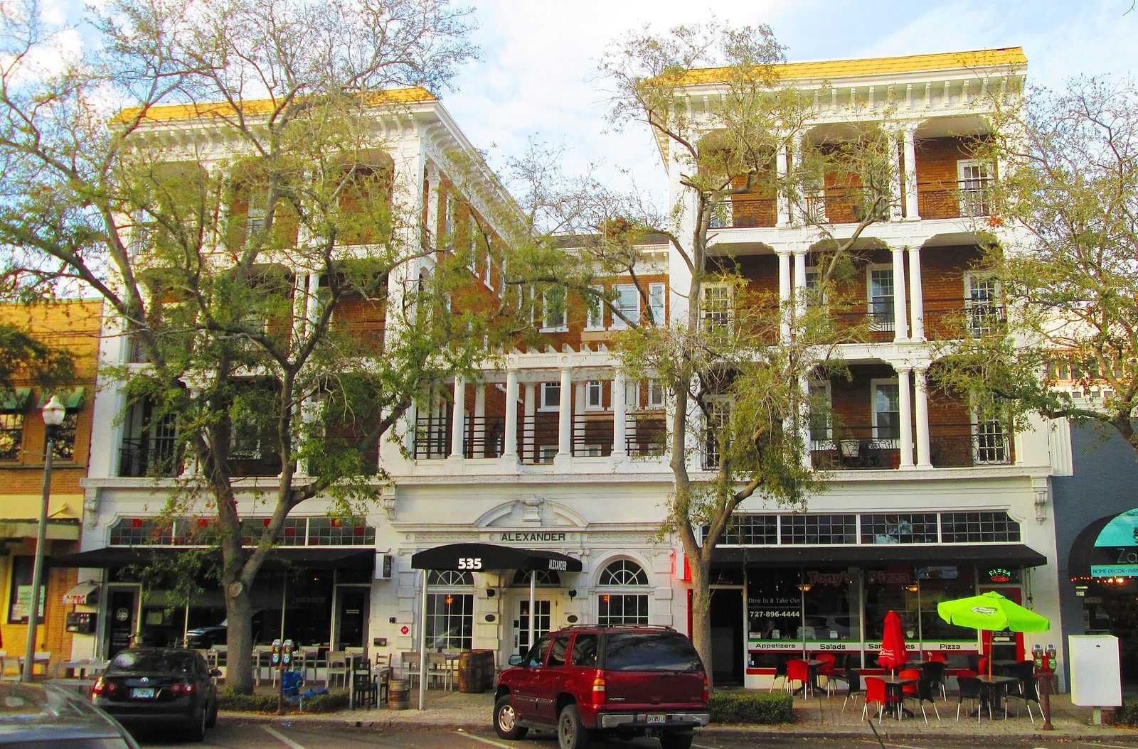 Storefronts and balconies of the Alexander Hotel building on Central Avenue in St. Petersburg, Florida