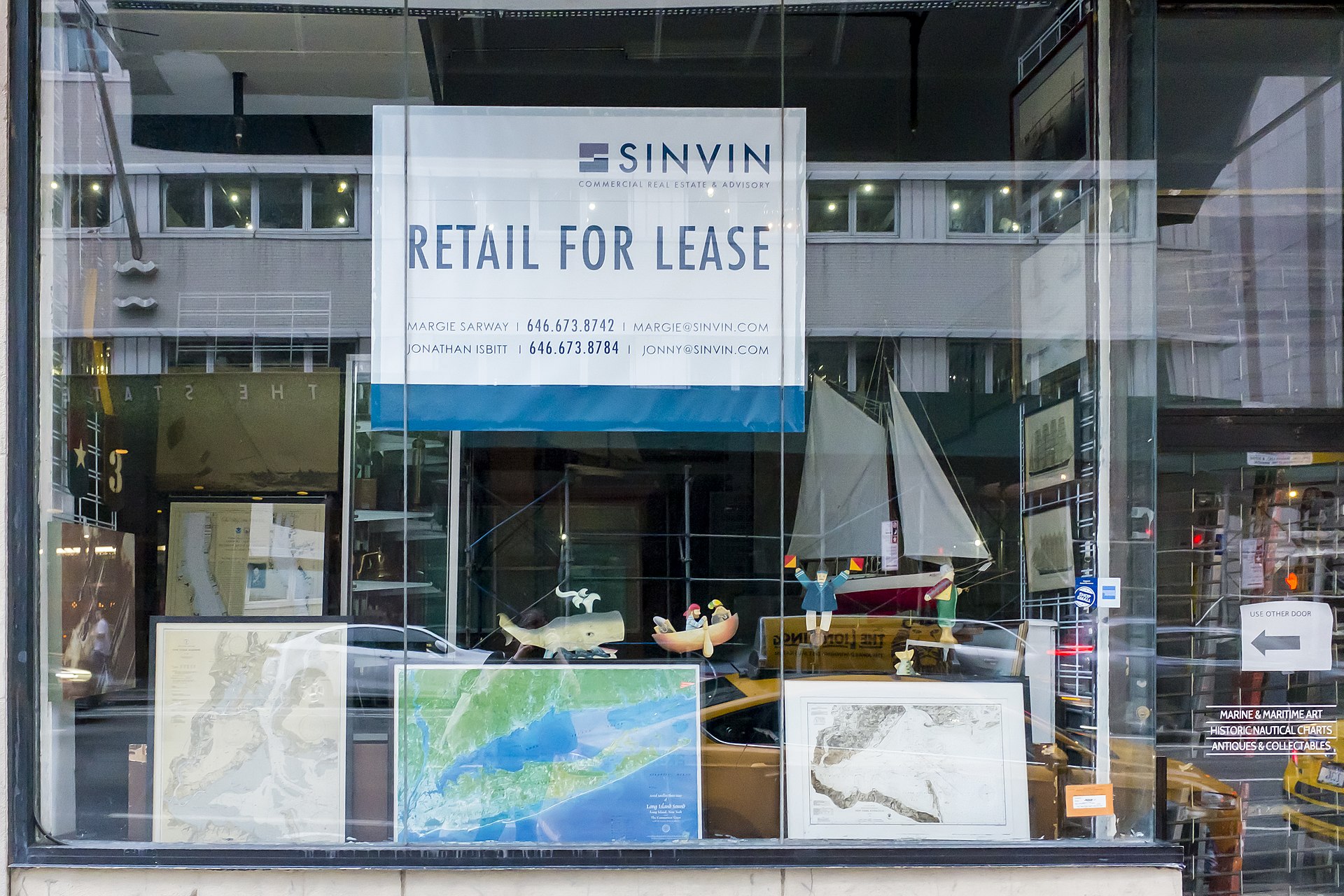A small, quiet shop with a dim window — the alternative every landlord is weighing.